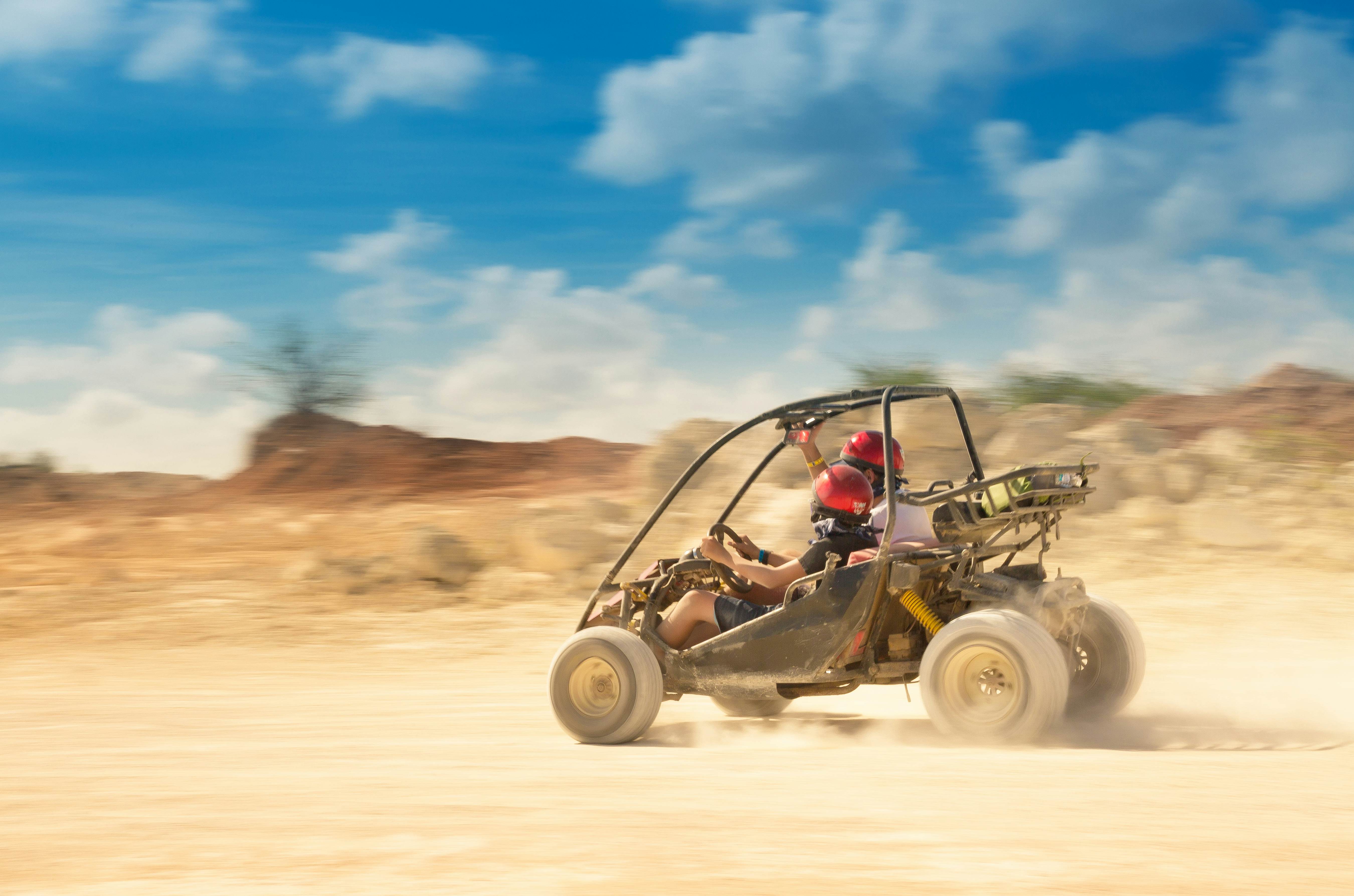 father and son driving a 4x4 in a quarry
